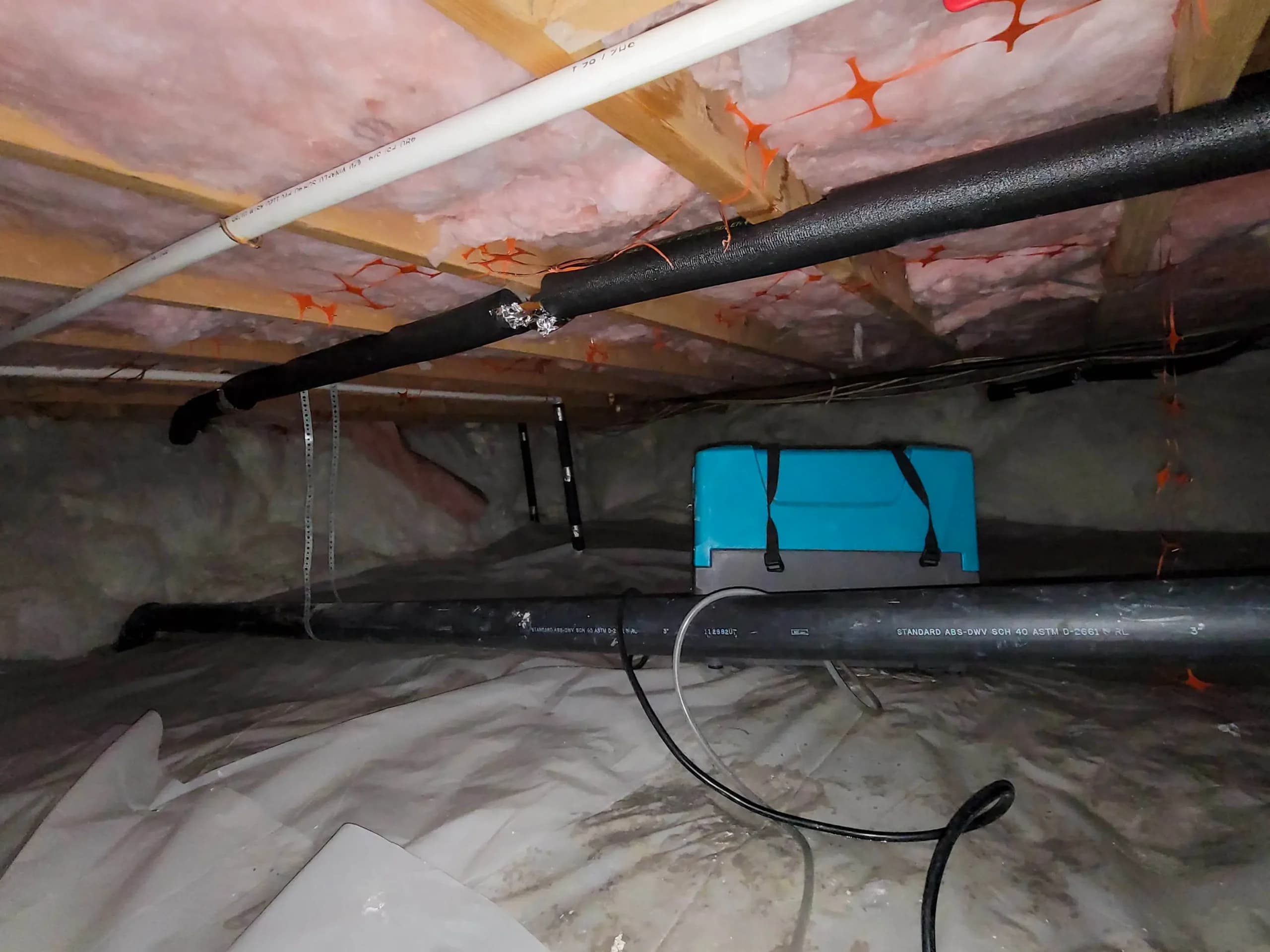 Insulated crawl space before restoration in Fayetteville, North Carolina