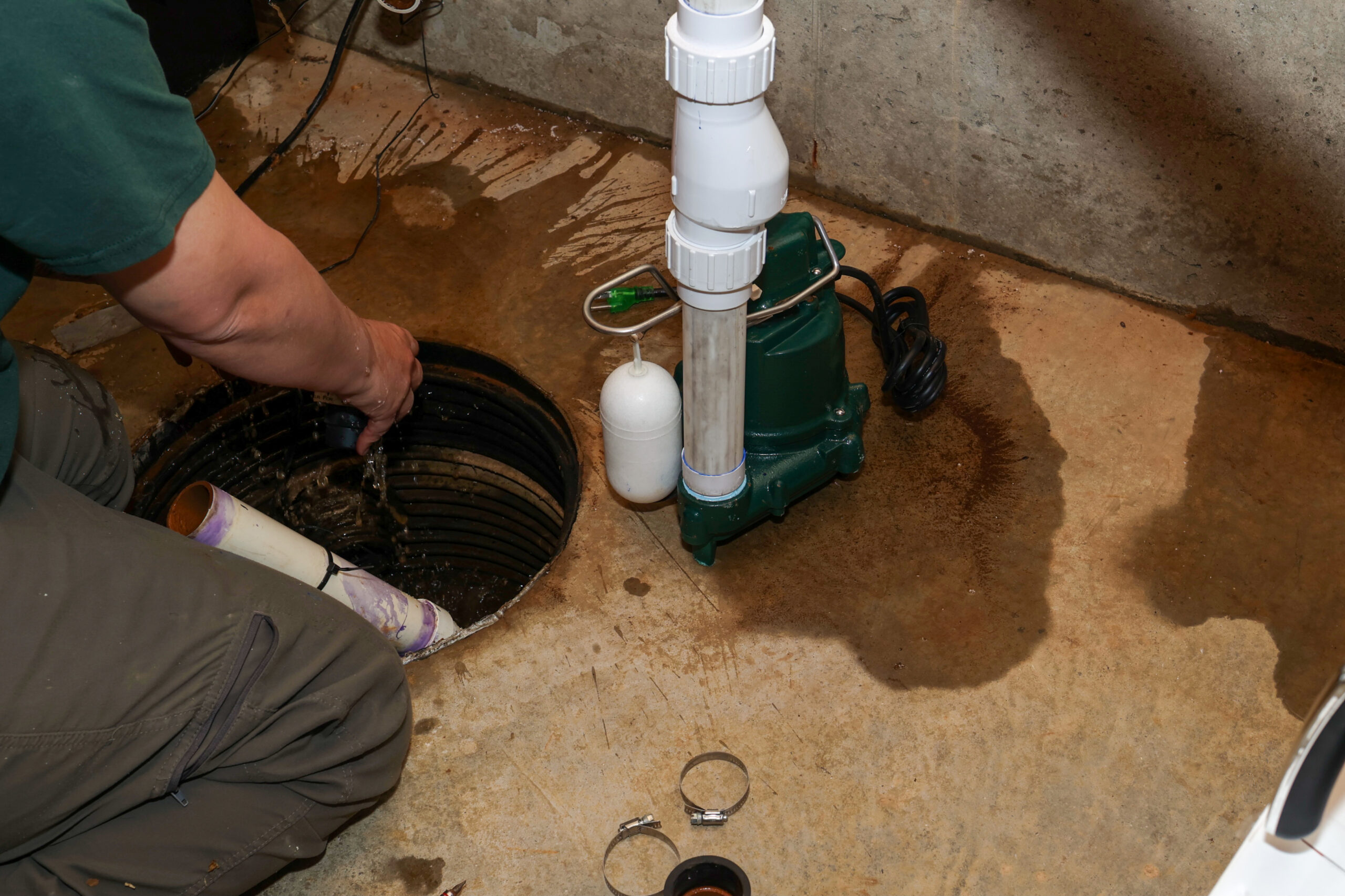 Basement sump pump being set up