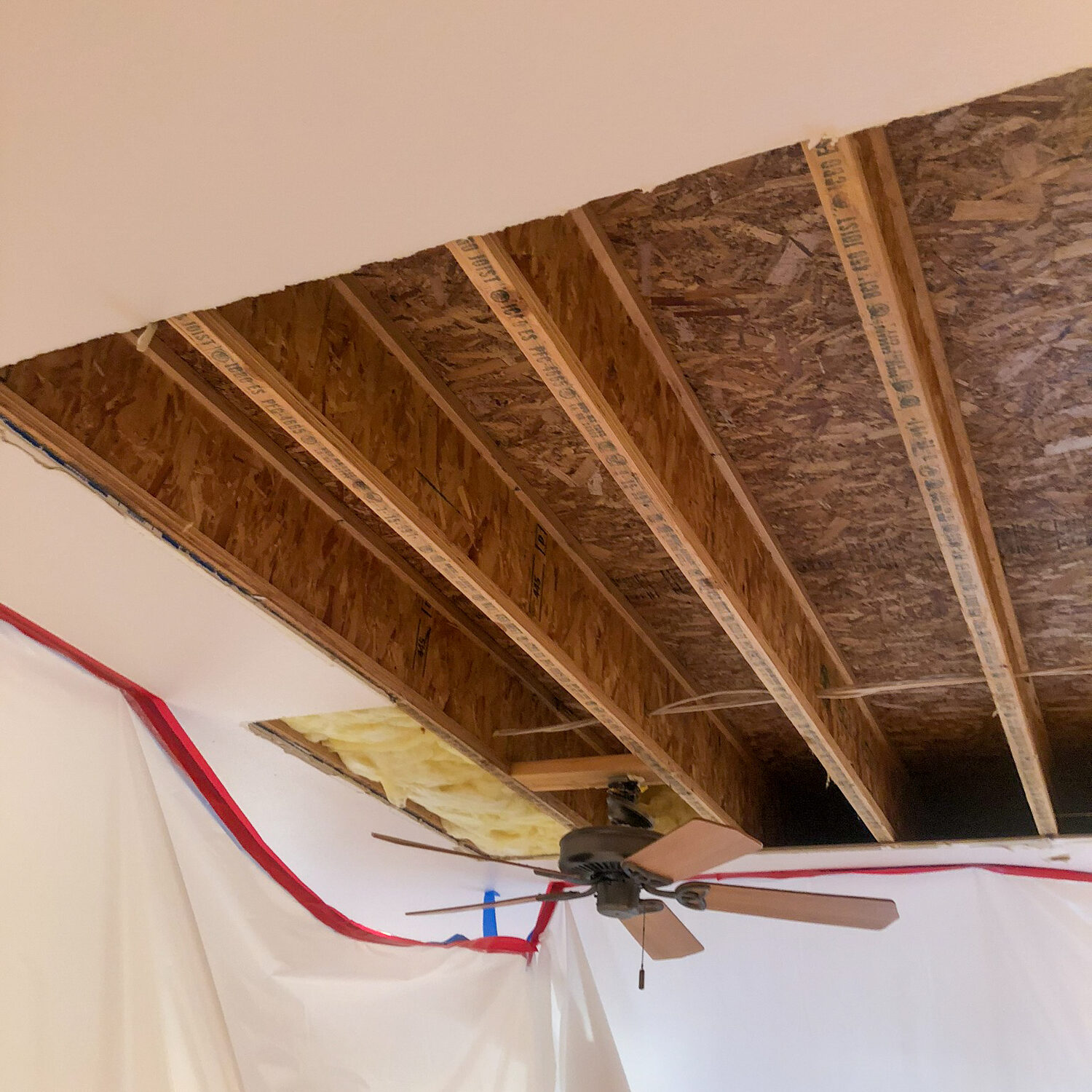 Ceiling renovation with protective plastic sheets